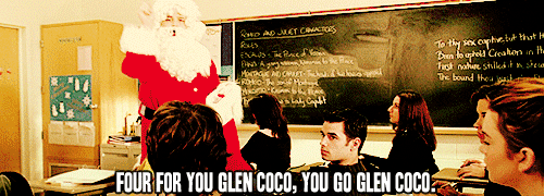 A man in a Santa suit throws candy canes to a student in a classroom. The text reads "Four for you Glen Coco, you go Glen Coco." (from Mean Girls)